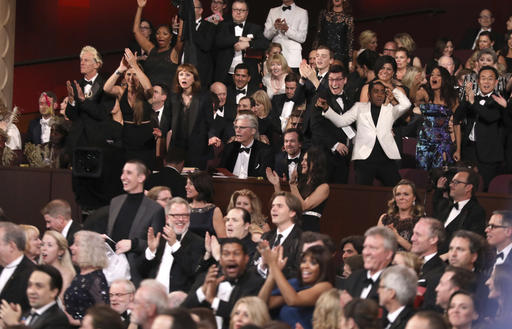 The cast of "Moonlight" celebrates as "Moonlight" wins the best picture award at the Oscars on Sunday, Feb. 26, 2017, at the Dolby Theatre in Los Angeles. 