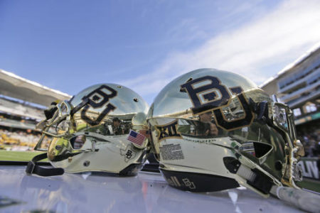 FILE - In this Dec. 5, 2015, file photo, Baylor helmets on shown the field after an NCAA college football game in Waco, Texas. Baylor University will look to rebuild its reputation and perhaps its football program after an outside review found administrators mishandled allegations of sexual assault and the team operated under the perception it was above the rules.