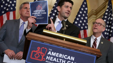 Speaker of the House Paul Ryan holds up a copy of the American Health Care Act, the House Republican leadership's plan to repeal and replace Obamacare, which is already facing opposition from conservatives in the House and Senate.
