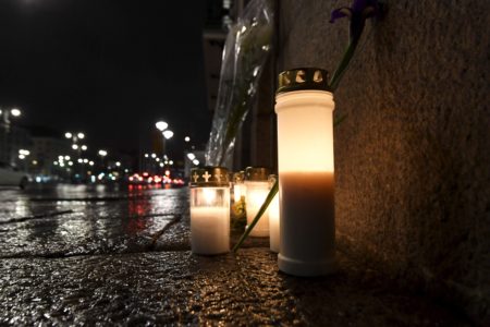 Memorial candles outside the Swedish Embassy in Helsinki on Friday evening April 7, 2017.  The driver of a hijacked beer truck is wanted by police after the truck crashed into an upscale department store in central Stockholm on Friday, leaving dead and injured in its wake.  (MARKKU ULANDER / Lehtikuva via AP)