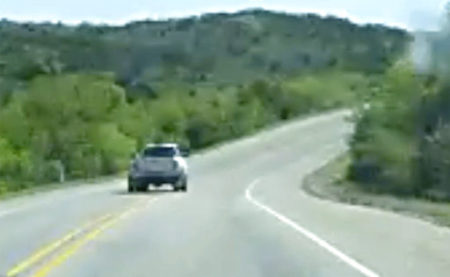 Frame grabs taken from the cell phone video of Thania Sanchez allegedly shows 20-year-old Jack Young periodically driving both over the double yellow as well as the white line on the right just moments before crashing into a church bus from New Braunfels and killing 13 people. (Thania Sanchez via AP)