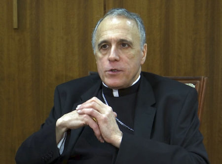 In this March 30, 2017 image taken from video, Cardinal Daniel Dinardo of the Archdiocese of the Houston-Galveston, speaks during an interview in Houston. The top Roman Catholic bishop in the U.S. lauds President Donald Trump for his anti-abortion views, for comments on the importance of Catholic schools and for promising to defend religious liberties.