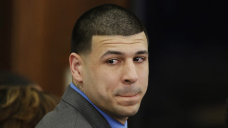 Former New England Patriots tight end Aaron Hernandez looks toward the jury as he reacts to his double murder acquittal last week. Hernandez hanged himself and was pronounced dead at a Massachusetts hospital early Wednesday, according to officials.