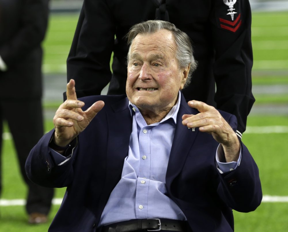 FILE - In this Feb. 5, 2017, file photo, former President George H.W. Bush arrives on the field for a coin toss before the NFL Super Bowl 51 football game between the Atlanta Falcons and the New England Patriots in Houston. Bush has been hospitalized in Houston since last Friday, Aprul 14, 2017,  with a recurrence of a case of pneumonia he had earlier in the year. Bush spokesman Jim McGrath said in a statement Tuesday, April 18, 2017, doctors determined he had a mild case of pneumonia which has been treated and resolved. McGrath said the former president "is in very good spirits and is being held for further observation while he regains his strength." (AP Photo/Eric Gay, File)