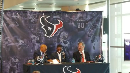 Andre Johnson sitting in between Rick Smith, General Manger of the Texans and Cal Mcnair Vice Chairmen