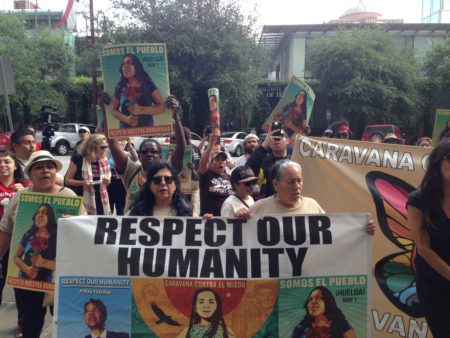 About 50 people marched through downtown Houston as part of the Caravan Against Fear to demand changes in the enforcement of immigration laws by the government.