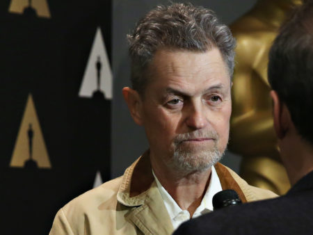 Jonathan Demme speaks with an interviewer at a 25th anniversary showing of The Silence of the Lambs at the Museum of Modern Art in New York City last year