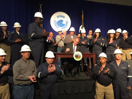 Interior Secretary Ryan Zinke signs two secretarial orders on energy development at an industry conference in Houston, TX.