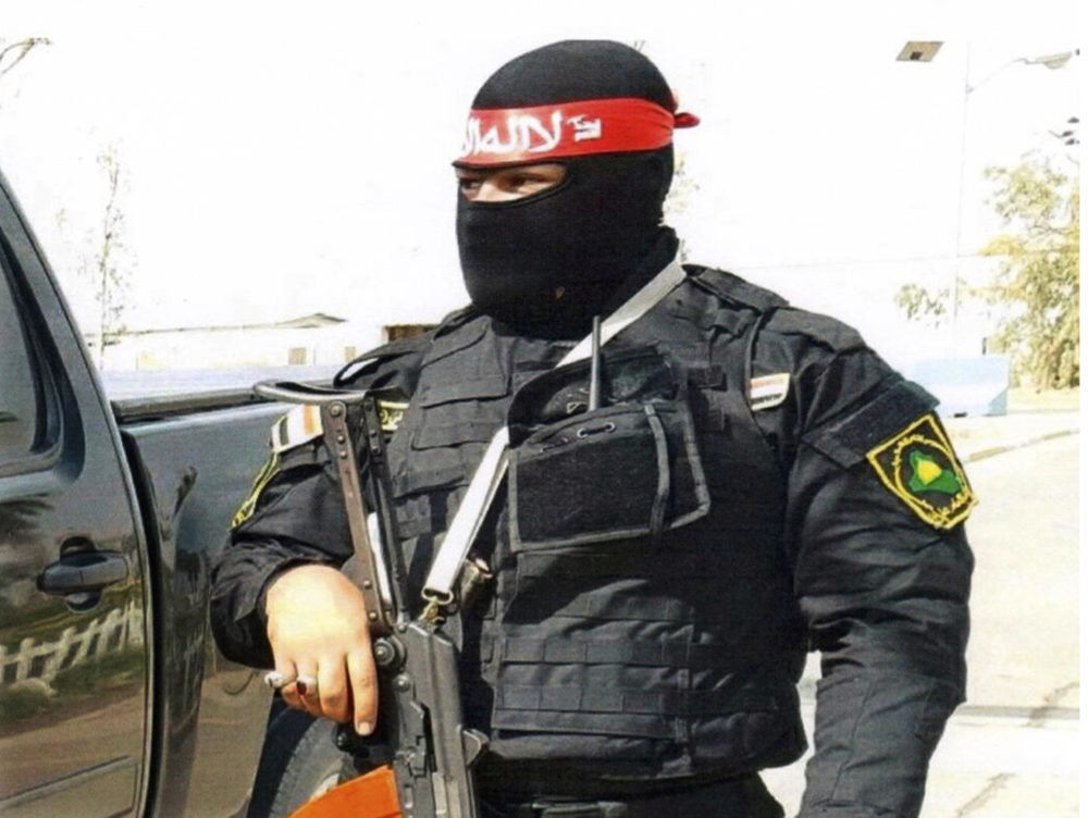 This undated photo obtained by the Associated Press shows an Iraqi bodyguard hired by Sallyport Global to protect VIPs. When a Toyota SUV was stolen from Balad air base, he became the chief suspect and was linked to a dangerous Iran-backed militia and was viewed by investigators as 