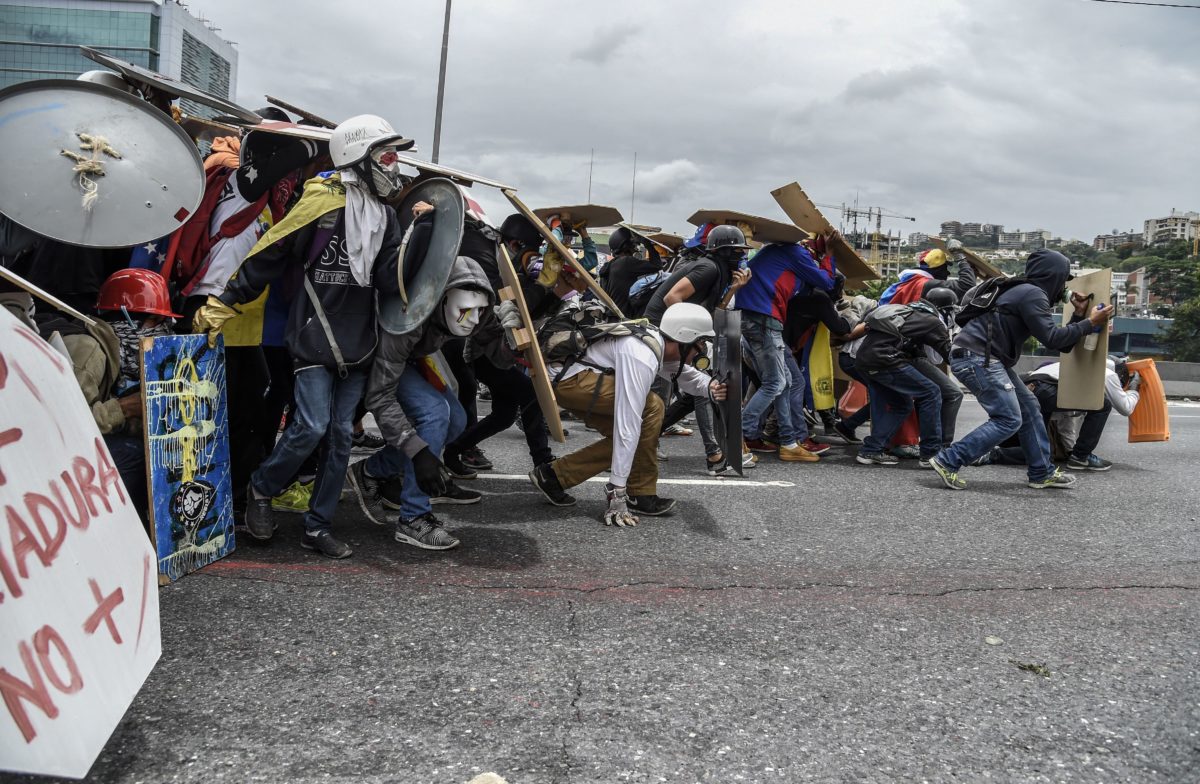 Riven By Fire And Fiery Rhetoric, Venezuela Decides Its Future In The ...