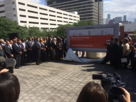 Mayor Sylvester Turner unveils a billboard for the 'Meaningful Change' campaign.
