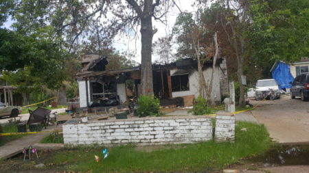 The home devastated by a house fire.