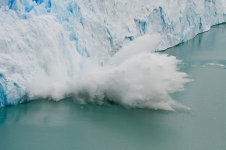 Large piece of ice colapses off of the edge of the Glacier Perito Moreno in Argentina