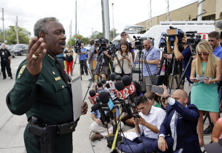 Orange County Sheriff Jerry Demings, left, answers questions at a news conference near the scene of a shooting where there were multiple fatalities in an industrial area near Orlando, Fla., Monday, June 5, 2017. The Orange County Sheriff's Office said on its official Twitter account that the situation has been contained.