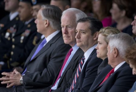 U.S. Sen. John Cornyn sits with U.S. Sen. Ted Cruz and wife Heidi Cruz at the Fort Hood Purple Heart ceremony on April 10, 2015.