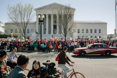 Hundreds gathered in front of the U.S. Supreme Court to show their support for President Obama’s immigration executive action as the Court hears oral arguments on the action in Washington, D.C., on April 18, 2016.