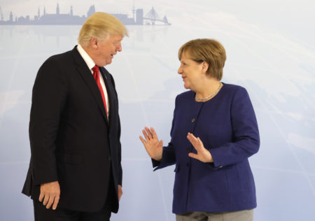 U.S. President Donald Trump, left, and German Chancellor Angela Merkel pose for a photograph prior to a bilateral meeting on the eve of the G-20 summit in Hamburg, northern Germany, Thursday, July 6, 2017. The leaders of the group of 20 meet July 7 and 8. (AP Photo/Matthias Schrader, pool)