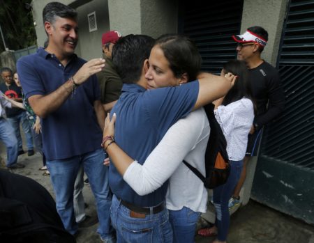 Supporters of opposition leader Leopoldo Lopez celebrate outside his home in Caracas, Venezuela, Saturday, July 8, 2017. Lopez has been transferred to house arrest. The court says in a statement early Saturday that Lopez was granted the "humanitarian measure" for health reasons. The 46-year-old Lopez has been behind bars at a military prison for more than three years.