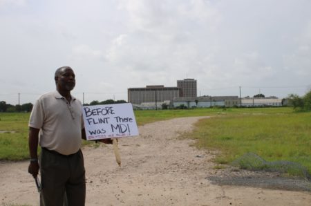 Rev. James Caldwell stands at the MDI Superfund site in Houston’s 5th Ward. The site was once home to a metal casting facility that spewed lead contamination on the surrounding community.