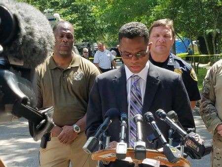 FBI ASAC Deron Ogletree and HPD Assistant Chief Larry Satterwhite (behind) speak at a press conference in the 2200 block of Albans in Houston this morning
