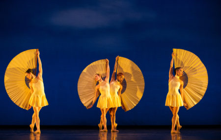 MOMIX dancers in yellow light