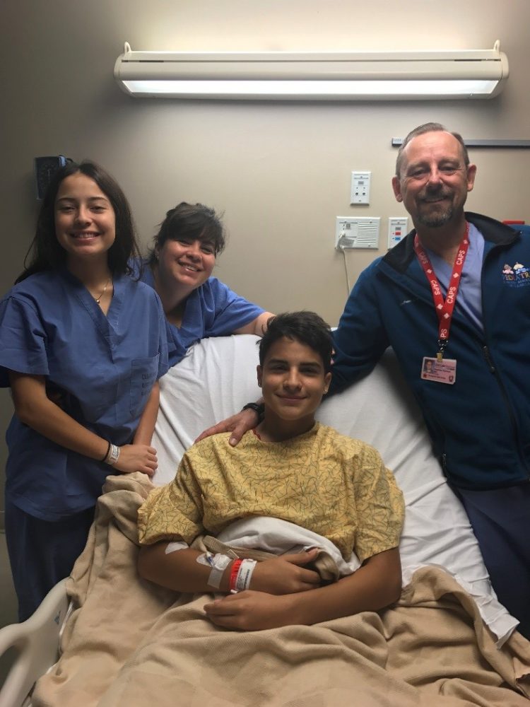 (R to L)16-year-old Jason Terrazas, Dr. Stephen Kimmel. Terrazas was suffering from a medical condition and Dr. Kimmel canoed to the hospital to perform surgery. 
