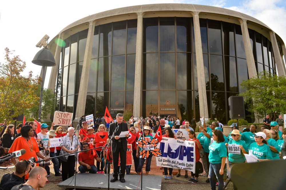 San Antonio Archbishop Gustavo Garcia-Siller speaks to protesters in front of the federal courthouse where U.S. District Judge Orlando Garcia is hearing arguments against Senate Bill 4, the so-called sanctuary cities law, on June 26, 2017.