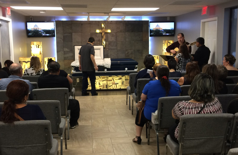 Mourners gather for Harvey victim Benito Juarez Cavazos at Del Pueblo Funeral Home in Houston, Texas, Friday, Sept. 1, 2017. Cavazos, 42, was found dead in a parking lot after floodwaters receded Tuesday near a Houston freeway. His death was being listed by police as a drowning or accident. 