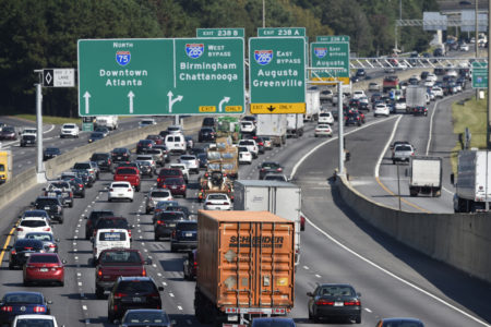 Heavy traffic on Interstate 75 moves slowly, Friday, Sept. 8, 2017, in Forrest Park, South of Atlanta. A massive evacuation has clogged Florida's major highways. So what they are doing is opening up the shoulders to drivers on Interstate 75 from Wildwood, where the Florida turnpike ends, to the Georgia state line.