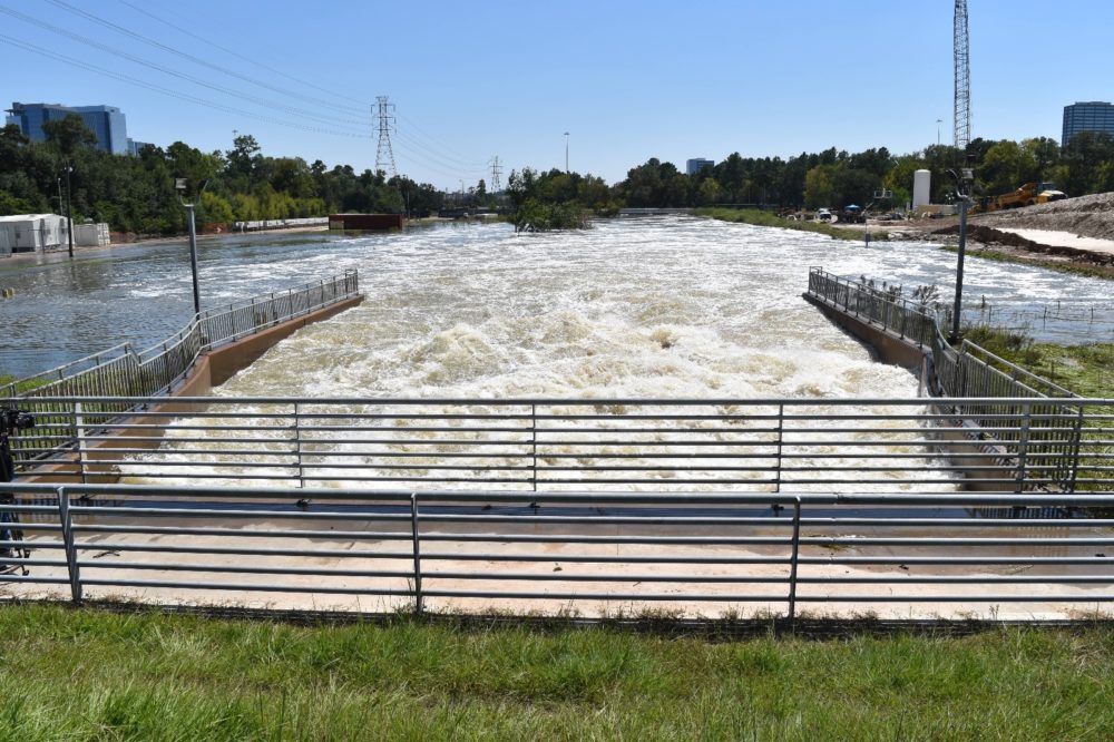 The water rushing out of the Addicks Reservoir.