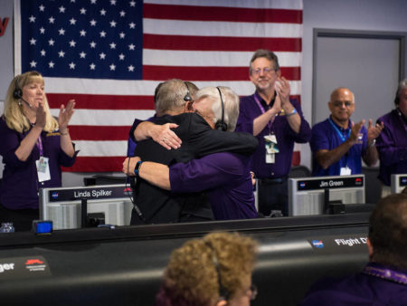 Earl Maize (left), Cassini program manager at JPL, and Julie Webster, spacecraft operations team manager for the Cassini mission at Saturn, embrace after the Cassini spacecraft plunged into Saturn on Friday at precisely 7:55 a.m. ET