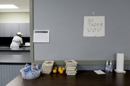 Kids leave food they don't want on a "No Thank You" table so others can pick it up at a community center in the East Texas community of Reklaw.