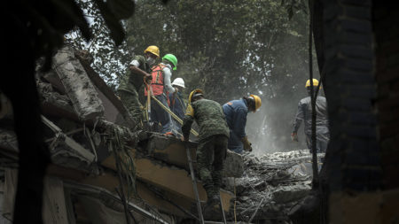 Rescue workers search for earthquake survivors in Mexico City on Wednesday.