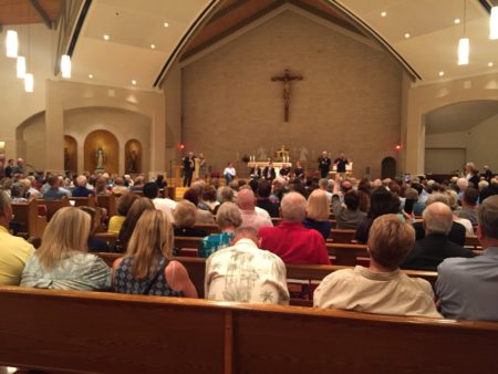 Residents gather at Saint John Vianney Catholic Church in west Houston to learn more and ask questions about Harvey recovery efforts.