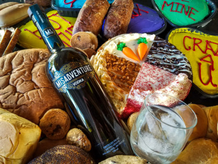 A bottle of Misadventure Vodka, which is made out of disregarded baked goods like cake and bread. The southern California distillery reduces food waste while also creating premium vodka.