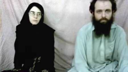 This still image made from a 2013 video released by the Coleman family shows Caitlan Coleman and her husband, Canadian Joshua Boyle, in a militant video given to the family.