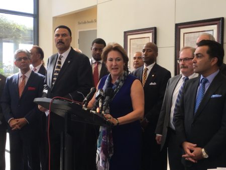Harris County District Attorney Kim Ogg (center) says her office will continue promoting the use of personal recognizance bonds and also will expand diversion programs for low-level drug offenders.