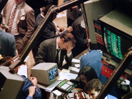 A trader at the New York Stock Exchange reacts on Oct. 19, 1987, when the Dow Jones industrial average plunged more than 22 percent — the biggest single-day drop in history. Maria Bastone/AFP/Getty Images