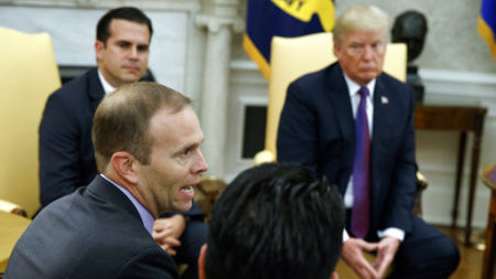 President Donald Trump and Puerto Rico Gov. Ricardo Rossello listen as FEMA Administrator Brock Long speaks during a meeting in the Oval Office Thursday at the White House. Evan Vucci/AP