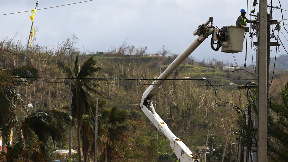 A worker repairs power lines in San Isidro, Puerto Rico. An outdated, aboveground power grid coupled with a comparative shortage of utility workers have hobbled efforts to restore power in the territory.
Mario Tama/Getty Images