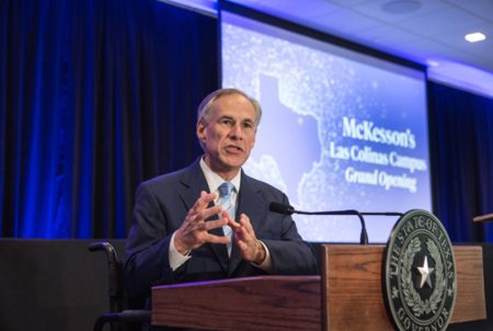 Texas Gov. Greg Abbott speaks at the grand opening of McKesson Corporation's campus in Irving on April 6, 2017. Abbott's office granted McKesson — the nation's largest drug distributer—  $9.75 million to help build the campus. Texas has since joined a 41-state investigation into whether McKesson and other drug companies helped fuel an opioid addiction crisis.
