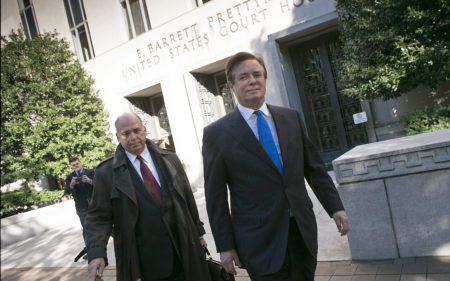 Former Trump campaign chairman Paul Manafort (right), leaves U.S. District Court after pleading not guilty to federal charges, including "conspiracy against the United States," on Monday in Washington, D.C.