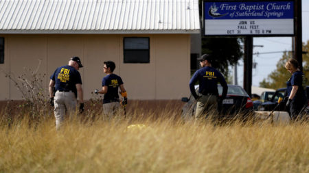 Law enforcement officials investigate the scene of a shooting at the First Baptist Church of Sutherland Springs, Texas, earlier this week in which 26 people were killed.