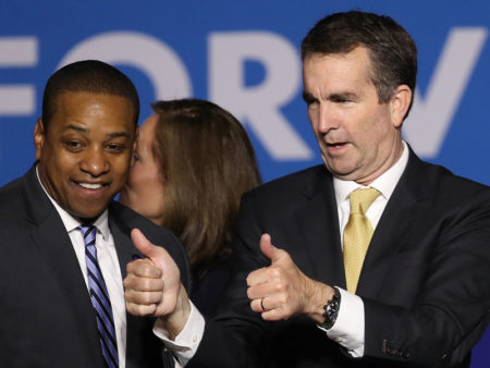 Virginia Gov.-elect Ralph Northam (right) and Lt. Gov.-elect Justin Fairfax greet supporters at an election night rally Tuesday after the Democrats' victory.