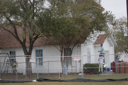Workers patch bullet holes and paint the exterior of the First Baptist Church in Sutherland Springs, Texas, on Thursday after a gunman opened fire during Sunday's service, killing the 26 people and wounding 20 others.