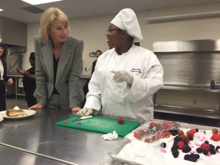 Betsy DeVos officially arrived st Humble ISD Summer Creek, gets a lesson on how to make sopapilla cheesecake.