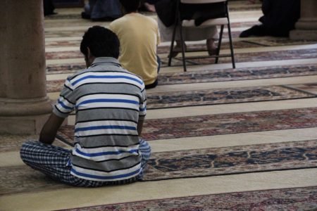 A man prays, at the River Oaks Islamic Center.