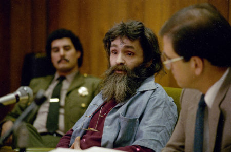 Charles Manson (center), seen during a parole hearing in California in 1986