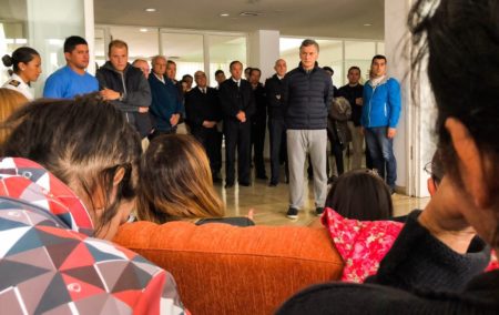 Argentina’s President Mauricio Macri, front right, listens to relatives of crew members from a missing submarine Monday, Nov. 20, 2017.