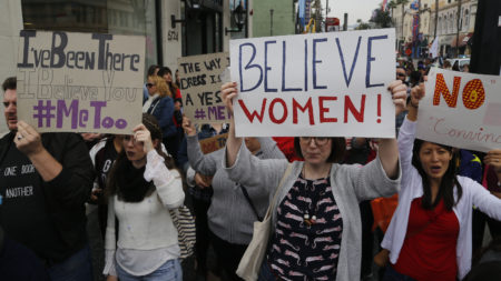 Demonstrators walk in the #MeToo March against sexual assault and harassment in Hollywood on Nov. 12. Nearly every day brings another apology from yet another high-profile man accused of serial sexual harassment.